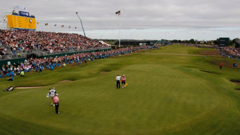 Ernie Els of South Africa reacts after putting on the 18th green with his caddie Ricky Roberts at Royal Lytham & St Annes golf club during the final round of the British Open Golf Championship, Lytham St Annes, England Sunday, July 22, 2012. (Chris Carlson/AP)