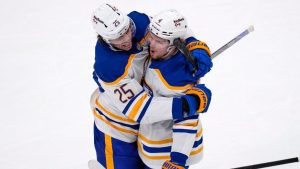 Buffalo Sabres defenceman Bowen Byram, right, is congratulated by Owen Power (25) after his goal during the second period in Game 3 of a first-round NHL hockey Stanley Cup playoff series, Thursday, April 23, 2026, in Boston. (Charles Krupa/AP Photo)