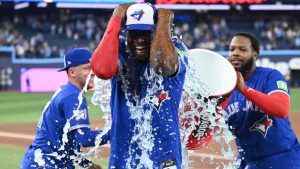 Toronto Blue Jays, from left, Myles Straw, Daulton Varsho and Jesus Sanchez celebrate their team's win over the Cleveland Guardians in MLB game action in Toronto on Sunday, April 26, 2026. (THE CANADIAN PRESS/Jon Blacker)
