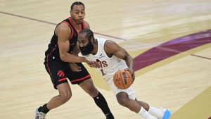 Cleveland Cavaliers guard James Harden drives on Toronto Raptors forward Scottie Barnes during the first half in Game 5 of a first-round NBA playoffs basketball series, Wednesday, April 29, 2026, In Cleveland. (David Dermer/AP)