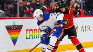 Buffalo Sabres' Josh Doan (91) skates with the puck as Ottawa Senators' Jordan Spence (10) tries to push him off during first period NHL hockey action in Ottawa on Thursday, April 2, 2026. (Sean Kilpatrick/CP)