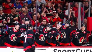 Ottawa Senators' Warren Foegele (37) celebrates his goal with the bench while taking on the Toronto Maple Leafs during second period NHL hockey action in Ottawa on Wednesday, April 15, 2026. (Sean Kilpatrick/CP)