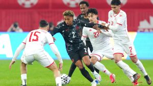 Canada's Jahkeele Marshall-Rutty, second left, tries to find a way through Tunisia's defence during second half International friendly action in Toronto, on Tuesday March 31, 2026. (Chris Young/THE CANADIAN PRESS)