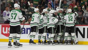 Dallas Stars players celebrate after the double overtime win against the Minnesota Wild of Game 3 in the first round of the NHL Stanley Cup hockey playoffs early morning Thursday, April 23, 2026, in St. Paul, Minn. (Abbie Parr/AP)