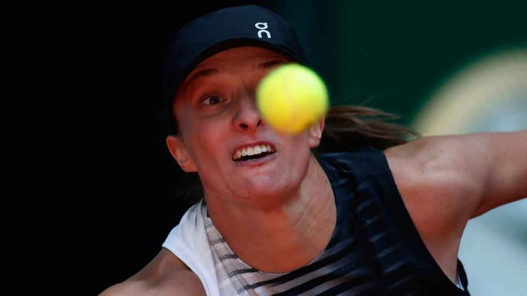 Iga Swiatek of Poland returns the ball to Ann Li of the U.S. during the Madrid Open tennis tournament in Madrid. (Pablo Garcia/AP)
