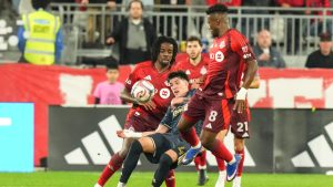 Philadelphia Union's Jovan Lukic (4) battles for the ball with Toronto FC's Jose Cifuentes (8) during first half MLS action in Toronto, on Wednesday, April 22, 2026. (Chris Young/CP)