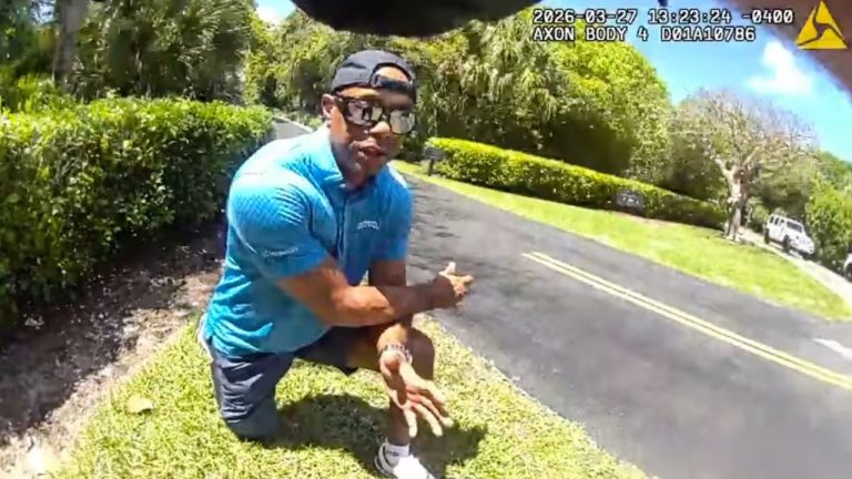 In this image taken from police body camera video released by the Martin County, Fla., Sheriff's Office, golfer Tiger Woods speaks with sheriff's deputies following a car crash in Jupiter Island, Fla., Friday, March 27, 2026. (Martin County Sheriff's Office via AP)