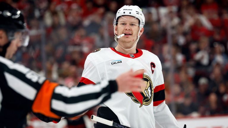 Ottawa Senators' Brady Tkachuk, right, protests a call with an official during the second period of an Game 1 of a Stanley Cup first-round playoff series against the Carolina Hurricanes in Raleigh, N.C., Saturday, April 18, 2026. (Karl DeBlaker/AP Photo)