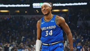 Orlando Magic centre Wendell Carter Jr. (34) smiles to teammates after sinking a 3-point shot against the Charlotte Hornets during the first half of an NBA play-in tournament basketball game, Friday, April 17, 2026, in Orlando, Fla. (John Raoux/AP)
