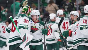 Minnesota Wild goaltender Jesper Wallstedt (30) reacts with defenceman Jared Spurgeon (46) after their team defeated the Dallas Stars 4-2 in Game 5 of a first-round NHL Stanley Cup playoffs hockey series, Tuesday, April 28, 2026, in Dallas. (Julio Cortez/AP)