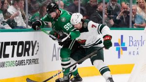 Dallas Stars defenceman Thomas Harley (55) and Minnesota Wild defenceman Brock Faber (7) compete for the puck in the first period of an NHL hockey game Thursday, April 9, 2026, in Arlington, Texas. (Tony Gutierrez/AP)