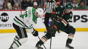 Dallas Stars center Colin Blackwell (15) and Minnesota Wild right wing Danila Yurov (22) battle for the puck during the first period of Game 3 in the first-round of the NHL Stanley Cup hockey playoffs Wednesday, April 22, 2026, in St. Paul, Minn. (Abbie Parr/AP)