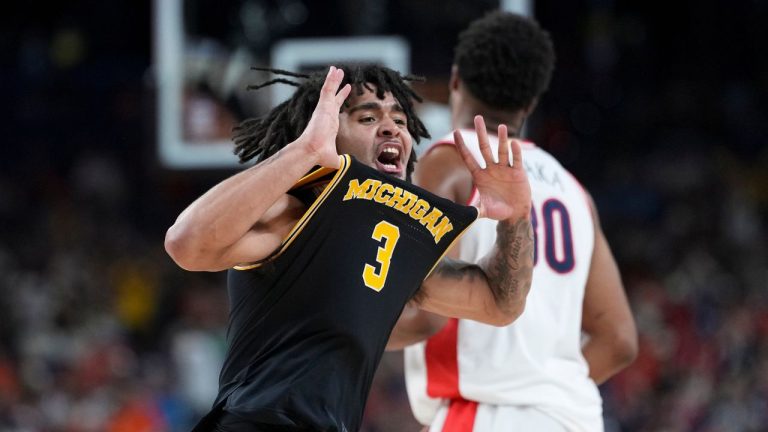 Michigan guard Elliot Cadeau (3) celebrates a basket against Arizona during the second half of an NCAA college basketball tournament semifinal game at the Final Four, Saturday, April 4, 2026, in Indianapolis. (Abbie Parr/AP)