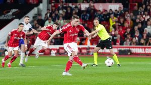 Nottingham Forest's Chris Wood scores their side's first goal from a penalty during the Europa League semifinal first leg match between Nottingham Forest and Aston Villa in Nottingham, England, Thursday, April 30, 2026. (David Davies/PA via AP)