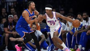Philadelphia 76ers' VJ Edgecombe, right, tries to get past New York Knicks' Jalen Brunson during the first half of Game 4 in a second-round NBA basketball playoffs series Sunday, May 10, 2026, in Philadelphia. (Matt Slocum/AP)