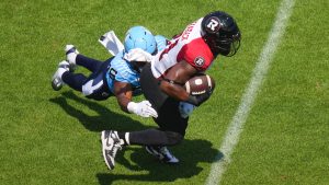 Ottawa Redblacks' William Stanback (31) is tackled by Toronto Argonauts' Aaron Casey (36) during CFL action in Toronto, on Saturday, Aug. 9, 2025. (Chris Young/CP)