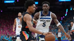 San Antonio Spurs guard Dylan Harper (2) drives against Minnesota Timberwolves guard Anthony Edwards (5) during the first half in Game 1 of a second-round NBA playoffs basketball series in San Antonio, Monday, May 4, 2026. (Eric Gay/AP)