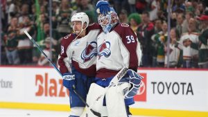 Colorado Avalanche centre Jack Drury, left, and Colorado Avalanche goaltender MacKenzie Blackwood (39) celebrate after Game 4 in a second-round NHL hockey Stanley Cup playoff series against the Minnesota Wild, Monday, May 11, 2026, in St. Paul, Minn. (Abbie Parr/AP)
