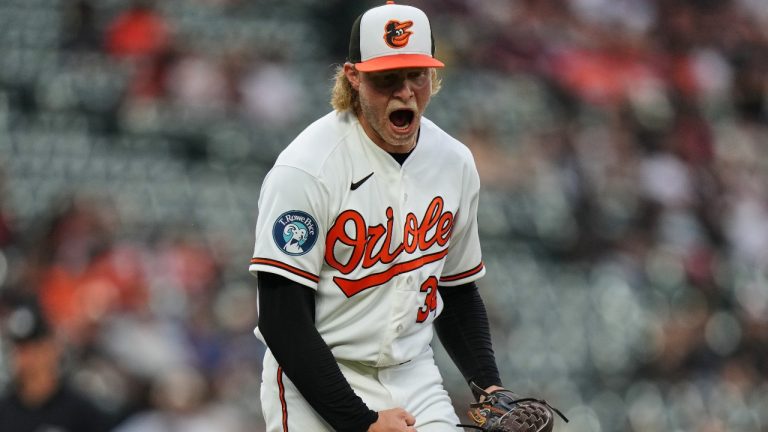 Baltimore Orioles starting pitcher Shane Baz reacts after striking out Tampa Bay Rays' Richie Palacios to retire the side during the third inning of a baseball game, Tuesday, May 26, 2026, in Baltimore. (AP Photo/Stephanie Scarbrough)