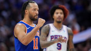 New York Knicks' Jalen Brunson, left, reacts past Philadelphia 76ers' Kelly Oubre Jr. during the first half of Game 3 in a second-round NBA basketball playoff series Friday, May 8, 2026, in Philadelphia. (Matt Slocum/AP)