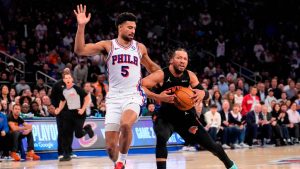 New York Knicks guard Jalen Brunson, right, drives past Philadelphia 76ers guard Quentin Grimes (5) during the first half of Game 2 in a second-round NBA basketball playoffs series, Wednesday, May 6, 2026, in New York. (Yuki Iwamura/AP)