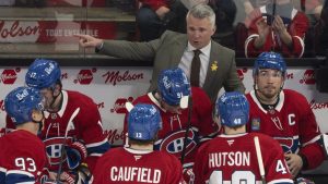 Montreal Canadiens head coach Martin St. Louis gives instructions to Cole Caufield (13) and teammates from the bench during first period NHL action against the Florida Panthers in Montreal on Tuesday, April 7, 2026. (Christinne Muschi/CP)