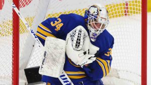 Buffalo Sabres goaltender Alex Lyon (34) makes a save during the third period in Game 5 of a first-round NHL hockey Stanley Cup playoff series against the Boston Bruins Tuesday, April 28, 2026, in Buffalo, N.Y. (Jeffrey T. Barnes/AP)
