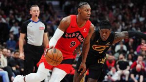 Toronto Raptors' RJ Barrett (9) drives past Cleveland Cavaliers' Dennis Schroder (8) during second half NBA playoff basketball action in Toronto on Friday, May 1, 2026. (Frank Gunn/CP)