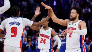 Detroit Pistons guard Cade Cunningham (2) celebrates with guards Ausar Thompson (9) and Daniss Jenkins (24) during the first half in Game 7 of a first-round NBA basketball playoffs series against the Orlando Magic, Sunday, May 3, 2026, in Detroit. (Duane Burleson/AP)