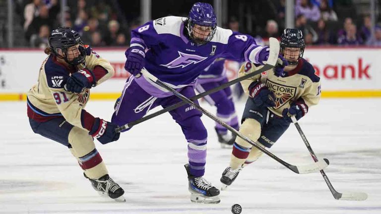 Minnesota Frost forward Samantha Cogan (8) skates for the puck as Montreal Victoire defenseman Maggie Flaherty (91), left, defends during the first period of game 3 of a PWHL hockey game semifinals game, Thursday, May 7, 2026, in St. Paul, Minn. (Abbie Parr/AP)