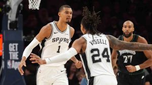 San Antonio Spurs forward Victor Wembanyama (1) celebrates a score against the Minnesota Timberwolves with teammate guard Devin Vassell (24) during the first half of Game 3 of a NBA basketball second-round playoff series in Minneapolis, Friday, May 8, 2026. (Abbie Parr/AP)