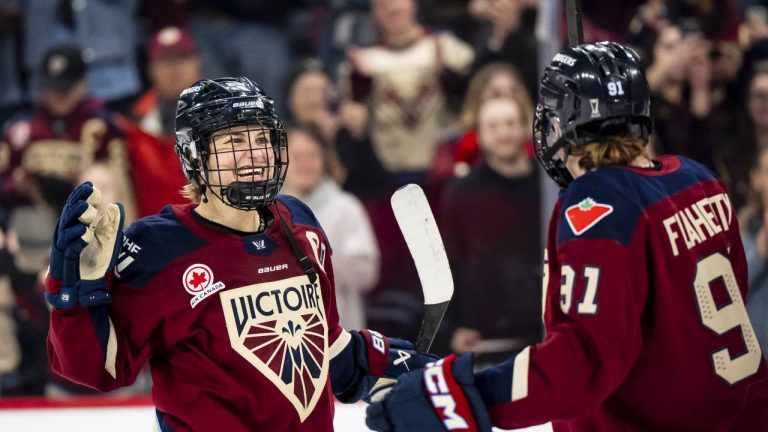 Montreal Victoire's Marie-Philip Poulin (29) celebrates with teammate Maggie Flaherty (91) after defeating the Minnesota Frost in PWHL playoff hockey action in Laval, Que., on Tuesday, May 12, 2026. THE CANADIAN PRESS/Christopher Katsarov