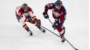Ottawa Charge's Emily Clark (26) defends against Montreal Victoire's Maggie Flaherty (91) during first period PWHL playoff hockey action in Laval, Que., on Saturday, May 16, 2026. THE CANADIAN PRESS/Christopher Katsarov