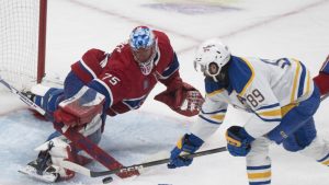 Montreal Canadiens goaltender Jakub Dobes (75) makes a save against Buffalo Sabres' Alex Tuch (89) during second period second round, Game 6, NHL playoff action in Montreal on Saturday, May 16, 2026. THE CANADIAN PRESS/Christinne Muschi