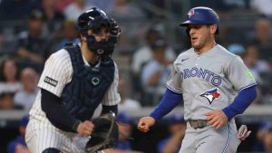 Toronto Blue Jays' Daulton Varsho runs home to score during the fourth inning of a baseball game against the New York Yankees, Tuesday, May 19, 2026, in New York. (Heather Khalifa/AP)