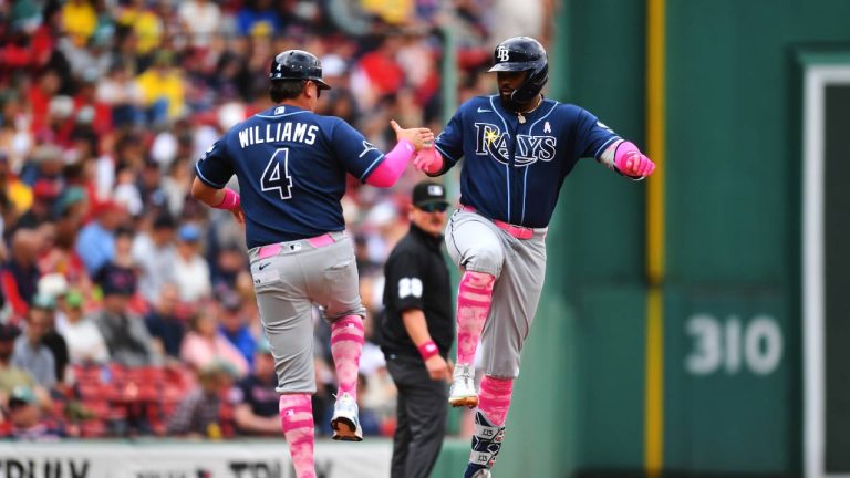 Tampa Bay Rays' Junior Caminero, right, celebrates after his home run with third base coach Brady Williams (4) as he runs the bases toward home in the first inning of a baseball game against the Boston Red Sox, Sunday, May 10, 2026, in Boston. (Steven Senne/AP)