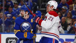 Buffalo Sabres defenceman Mattias Samuelsson, right, and Montreal Canadiens defenceman Kaiden Guhle (21) battle for position during the first period in Game 2 of a second-round NHL hockey Stanley Cup playoff series, Friday, May 8, 2026, in Buffalo, N.Y. (Jeffrey T. Barnes/AP)
