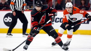 Carolina Hurricanes' Logan Stankoven, controls the puck in front of Philadelphia Flyers' Denver Barkey, right, during the first period of Game 1 of an NHL hockey Stanley Cup second-round playoff series in Raleigh, N.C., Saturday, May 2, 2026. (Karl DeBlaker/AP)