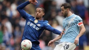 Chelsea's Joao Pedro, left, and Manchester City's Bernardo Silva challenge for the ball during the English FA Cup final soccer match between Chelsea and Manchester City in London, Saturday, May 16, 2026. (Richard Pelham/AP)