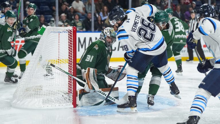 Everett Silvertips goalie Anders Miller (31) watches the puck after stopping Chicoutimi Sagueneens' Emmanuel Vermette (28) during the second period of the Memorial Cup semifinal hockey game, in Kelowna, B.C., on Friday, May 29, 2026. (Darryl Dyck/CP)