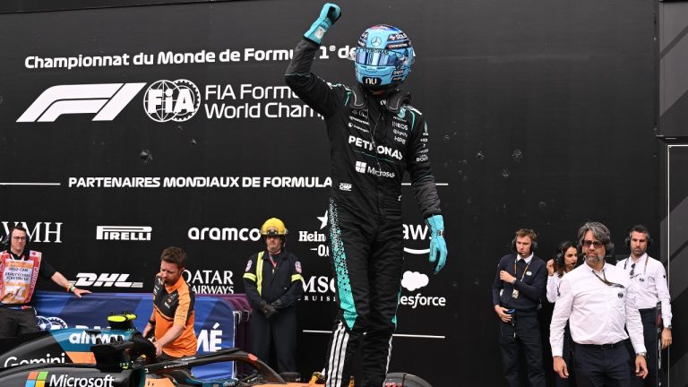 Mercedes driver George Russell of the United Kingdom celebrates as he takes pole following qualifying at the Formula One auto racing Canadian Grand Prix in Montreal on Saturday, May 23, 2026. (Graham Hughes/CP)
