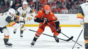 Anaheim Ducks' Leo Carlsson (91) brings the puck across the blue line against Vegas Golden Knights' Pavel Dorofeyev (16) during the first period of an NHL hockey game, Sunday, May 10, 2026, in Anaheim, Calif. (Scott Strazzante/AP)