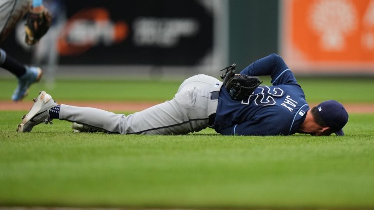Tampa Bay Rays starting pitcher Griffin Jax (22) reacts after an injury during the second inning of a baseball game against the Baltimore Orioles, Tuesday, May 26, 2026, in Baltimore. (AP Photo/Stephanie Scarbrough)