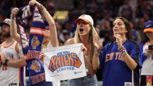 New York Knicks fans cheer during the second half of Game 4 in the Eastern Conference finals NBA basketball playoffs series against the Cleveland Cavaliers in Cleveland, Monday, May 25, 2026. (AP Photo/Tim Phillis)