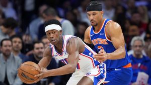 Philadelphia 76ers' Vj Edgecombe, left, tries to get past New York Knicks' Josh Hart during the first half of Game 3 in a second-round NBA basketball playoff series Friday, May 8, 2026, in Philadelphia. (Matt Slocum/AP)