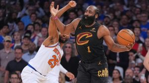 New York Knicks' Mikal Bridges, left, covers Cleveland Cavaliers' James Harden during the overtime period of Game 1 in the Eastern Conference finals NBA basketball playoffs series Tuesday, May 19, 2026, in New York. (Seth Wenig/AP)