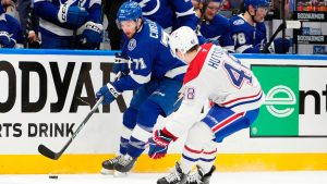 Tampa Bay Lightning centre Anthony Cirelli (71) tries to cut around Montreal Canadiens defenceman Lane Hutson (48) during the second period in Game 7 of an NHL hockey Stanley Cup first-round playoff series, Sunday, May 3, 2026, in Tampa, Fla. (Chris O'Meara/AP)