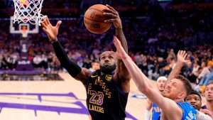 Los Angeles Lakers forward LeBron James, left, grabs a rebound away from Oklahoma City Thunder center Isaiah Hartenstein during the first half of Game 4 in a second-round NBA basketball playoffs series Monday, May 11, 2026, in Los Angeles. (Mark J. Terrill/AP)