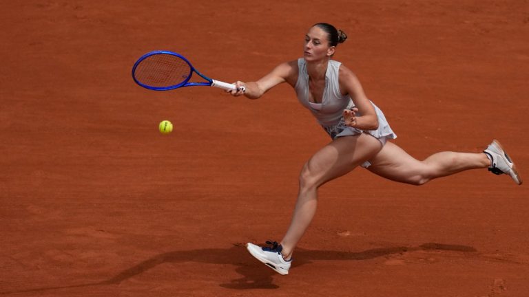 Ukraine's Marta Kostyuk returns to Poland's Iga Swiatek during the fourth-round tennis match at the French Open in Paris, Sunday, May 31, 2026. (Christophe Ena/AP)