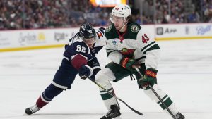 Minnesota Wild defenseman Quinn Hughes, right, drives past Colorado Avalanche left wing Artturi Lehkonen in the second period of an NHL hockey game Thursday, Feb. 26, 2026, in Denver. (David Zalubowski/AP)